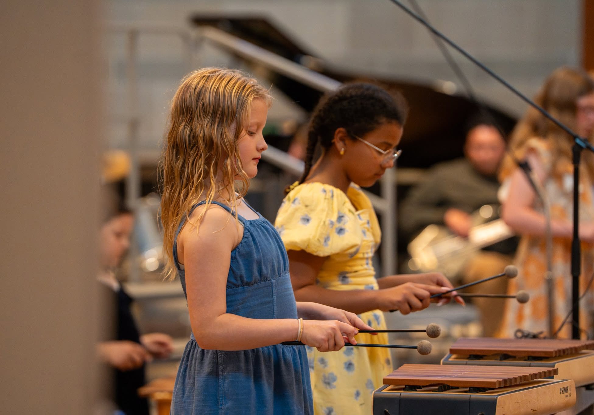 Two girls playing instruments